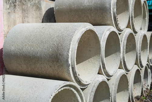 Asbestos cement pipes stacked on a construction site