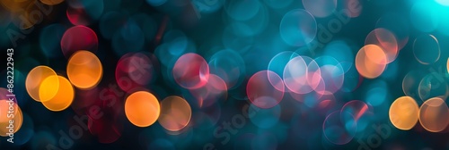 focus colorful bokeh on a dark almost black background, 3:1, banner, new years event © rajagambar99