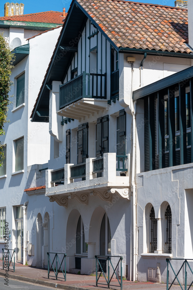 Naklejka premium White houses and villas of old Saint Jean de Luz on Basque coast, famous resort, known for beautiful architecture, nature and cuisine, South of France, Basque Country