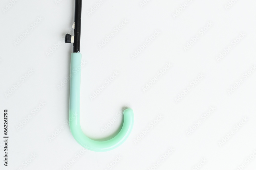 handle of green umbrella isolated on white background handle of green umbrella isolated on white background