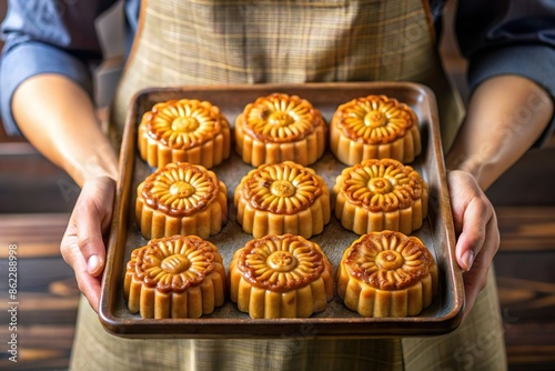 hand hold mooncake tray. Lunar festival food photo