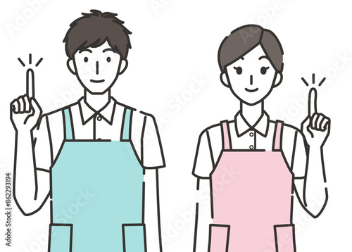 指差しポーズの介護士の男性と女性