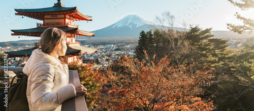 Woman tourist with mount Fuji at Chureito Pagoda in Autumn season, Traveler travel Arakurayama Sengen Park, Yamanashi, Japan. Landmark for tourist attraction. Japan Travel, Destination and Vacation