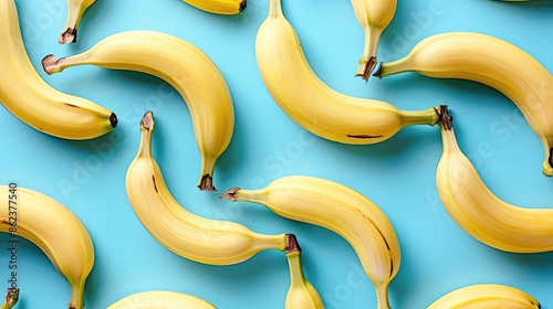 A bunch of bananas are arranged in a pattern on a blue background