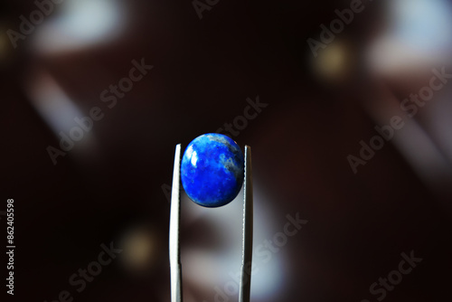 Lapis Is a beautiful natural gemstone on a wooden floor.