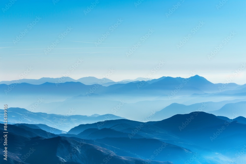A breathtaking view of a distant mountain range with layered peaks under a clear sky, showcasing natural beauty and serene landscapes A breathtaking view of a distant mountain range with layered peaks under a clear sky, showcasing natural beauty and serene landscapes