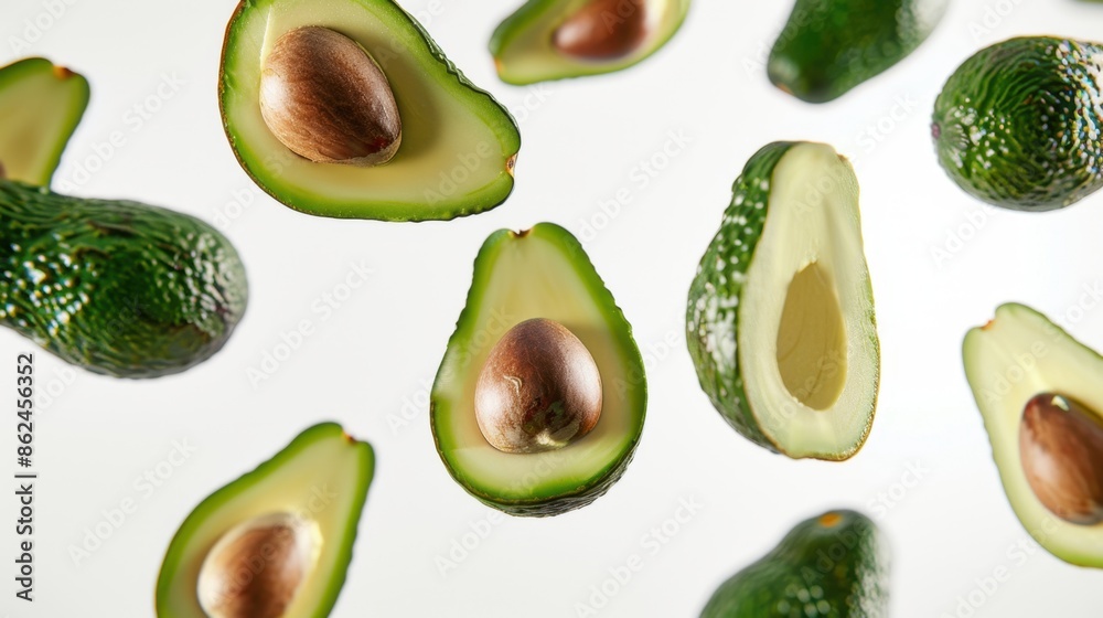 Falling Avocado Halves and Whole Avocados Falling Avocado Halves and Whole Avocados
