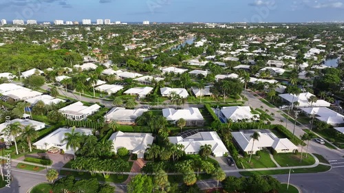 Aerial view of luxury homes in a gated golf community in Florida: American dream living and suburban real estate development.