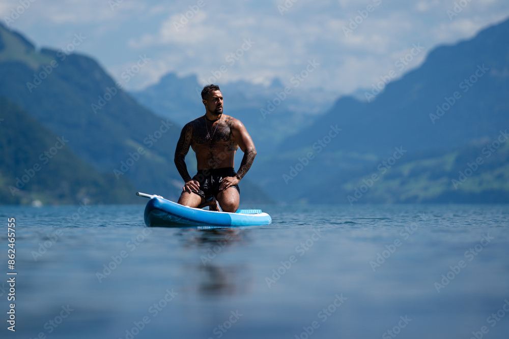 Sexy man with paddle board. Man paddling on paddleboard. Muscular strong Hispanic man on sup board paddle surfing. SUP surfing in summer vacation in lake. Strong muscular wet body. Bare naked torso. Sexy man with paddle board. Man paddling on paddleboard. Muscular strong Hispanic man on sup board paddle surfing. SUP surfing in summer vacation in lake. Strong muscular wet body. Bare naked torso.