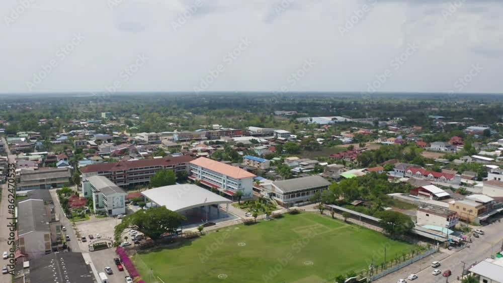 Aerial view of local residential neighborhood roofs. Urban housing development from above. Top view. Real estate in Isan urban city town, Thailand. Property real estate. Aerial view of local residential neighborhood roofs. Urban housing development from above. Top view. Real estate in Isan urban city town, Thailand. Property real estate.