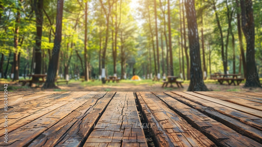 Camping wooden tabletop, empty wood table top in green forest, concept of outdoor nature activity dais podium counter product display platform mockup background banner. Camping wooden tabletop, empty wood table top in green forest, concept of outdoor nature activity dais podium counter product display platform mockup background banner.