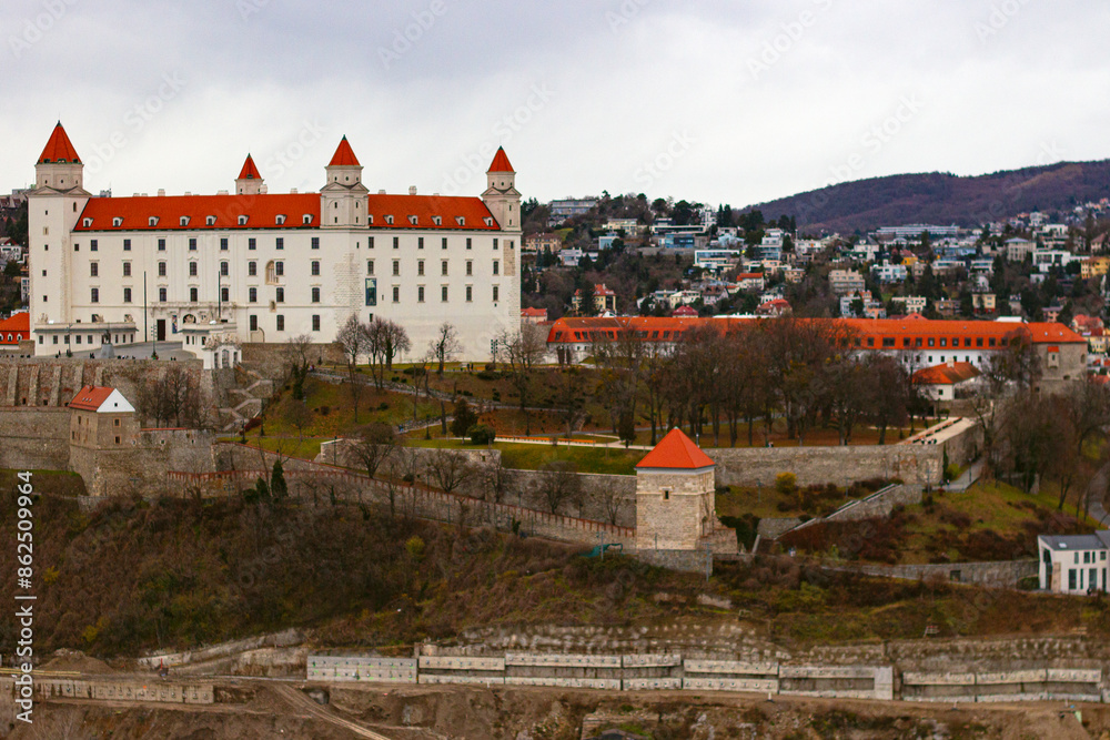 View on the Bratislava Castle, the main castle of Bratislava, Slovakia. It stands on isolated rocky hill of the Little Carpathians, directly above the Danube river View on the Bratislava Castle, the main castle of Bratislava, Slovakia. It stands on isolated rocky hill of the Little Carpathians, directly above the Danube river