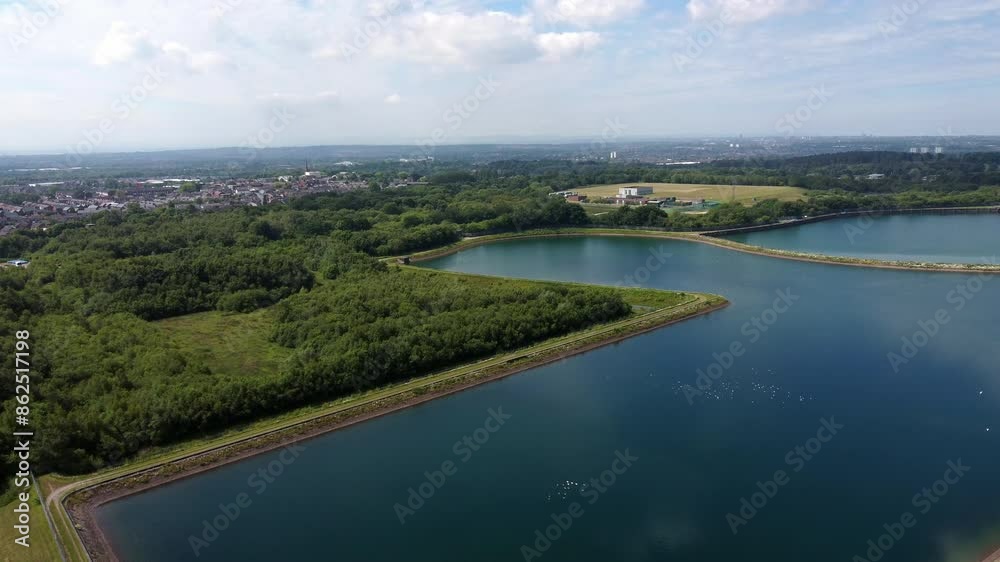 Aerial view high above water supply reservoir blue sky reflections in rural countryside lake Aerial view high above water supply reservoir blue sky reflections in rural countryside lake