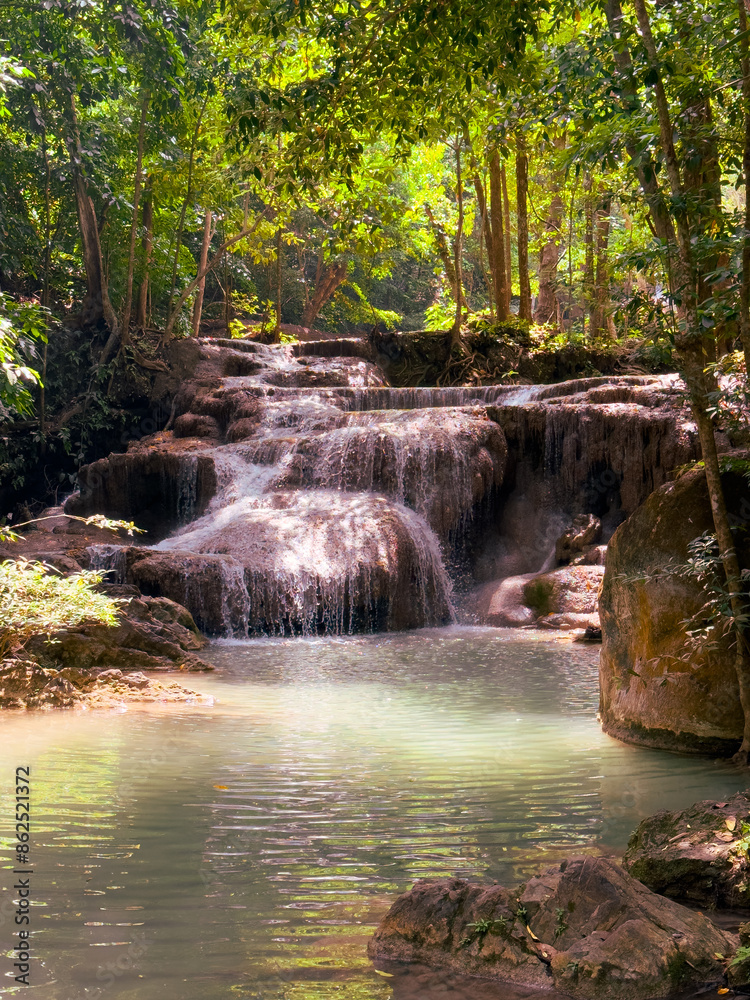Fototapeta premium Waterfall on a river in the tropical forest of Thailand