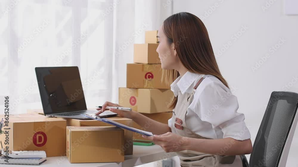 asian young woman owner packing product box prepare to the package for delivery to the customer on sofa at home office asian Entrepreneur SME business concept. asian young woman owner packing product box prepare to the package for delivery to the customer on sofa at home office asian Entrepreneur SME business concept.