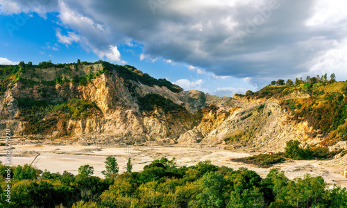 landscape of Plegrean volcano fields in Naples Italy near Pompeii with sulfur yellow caldera duribg eruption of smoke. campi Flegrei and cataclysm of Earthquake photo