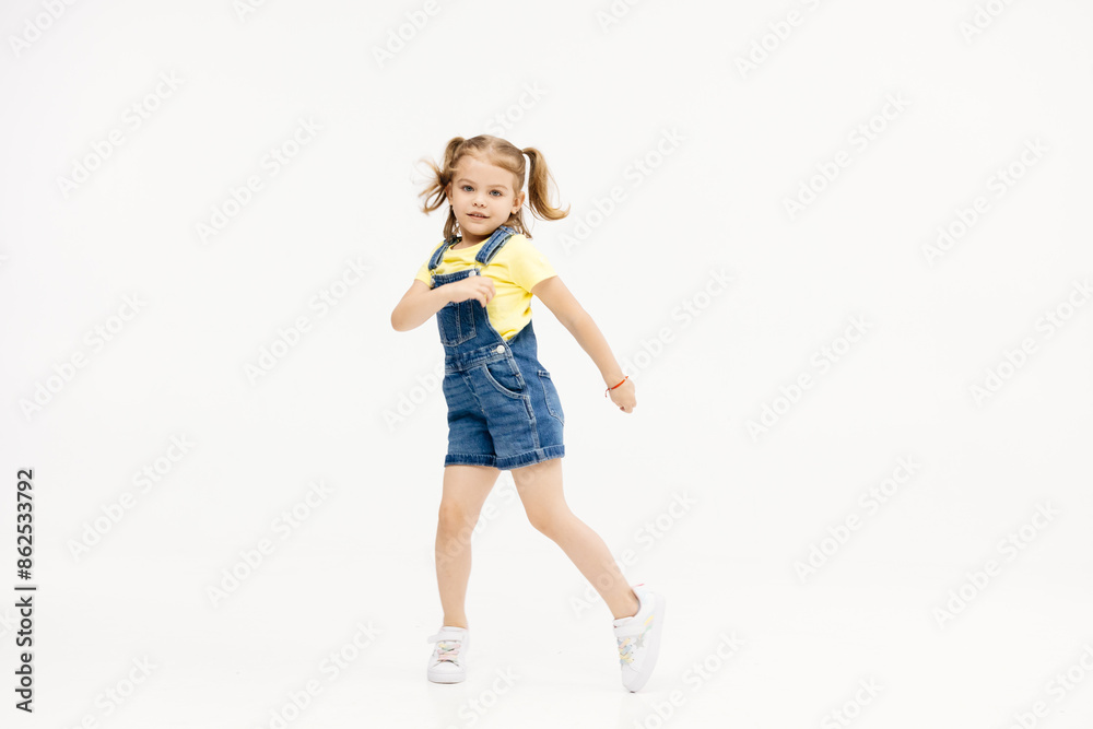 Happy smiling child having fun on white studio background. The concept of childhood and childish emotions. Happy smiling child having fun on white studio background. The concept of childhood and childish emotions.
