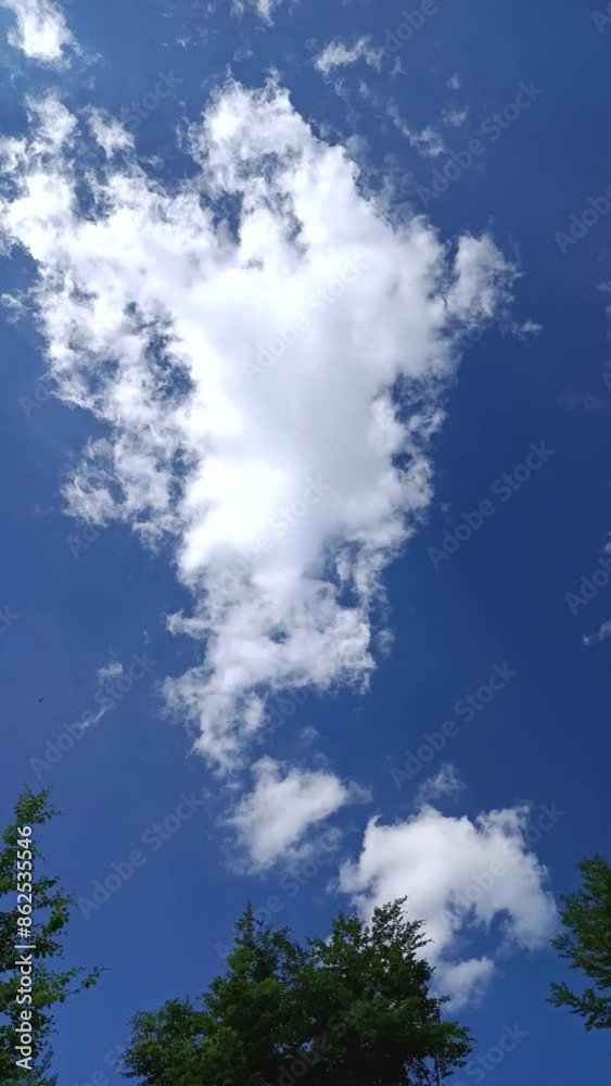 White clouds on blue sky, moving in a circle White clouds on blue sky, moving in a circle