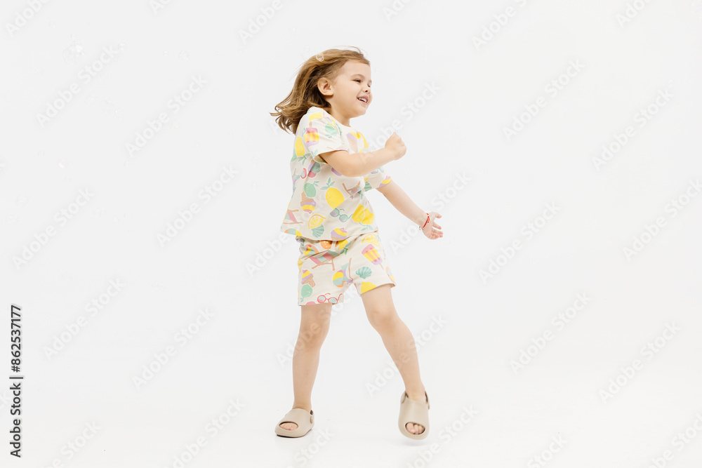 Happy smiling child having fun on white studio background. The concept of childhood and childish emotions. Happy smiling child having fun on white studio background. The concept of childhood and childish emotions.