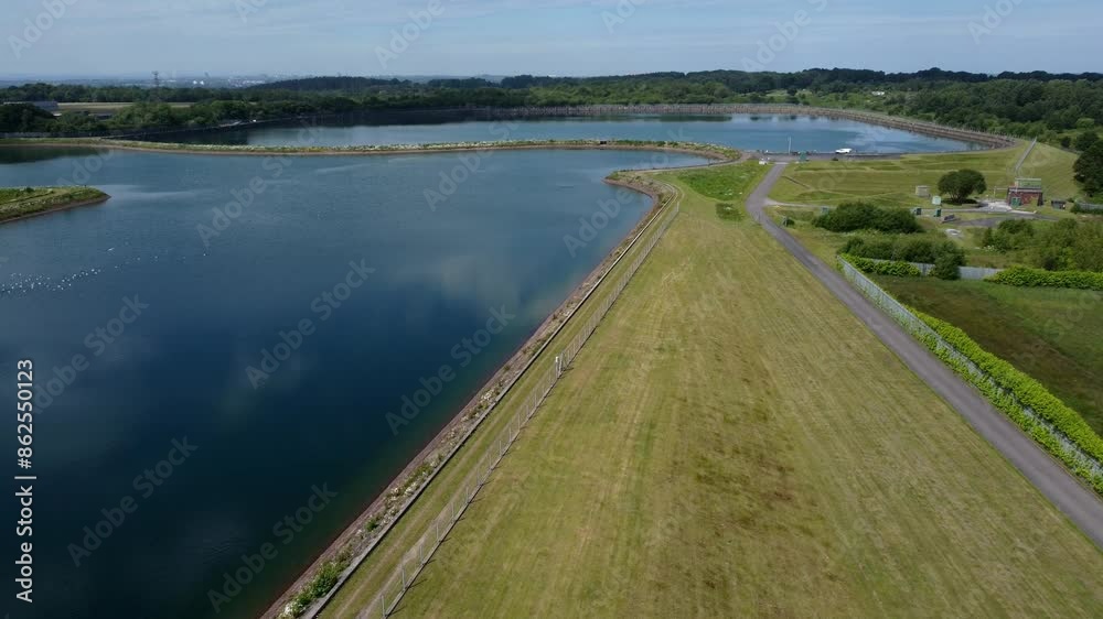 Water supply reservoir sewage contamination social issues aerial view descending alongside lake