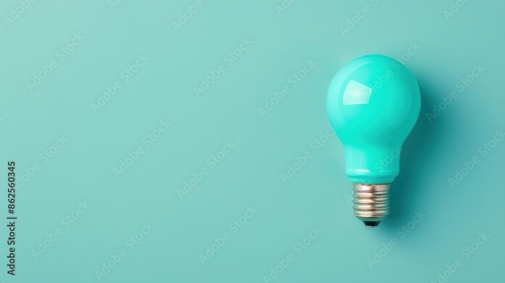 A stylish and minimalist composition featuring a blue lightbulb on a plain background, symbolizing creativity and innovation. The image offers ample copy space for customization. A stylish and minimalist composition featuring a blue lightbulb on a plain background, symbolizing creativity and innovation. The image offers ample copy space for customization.