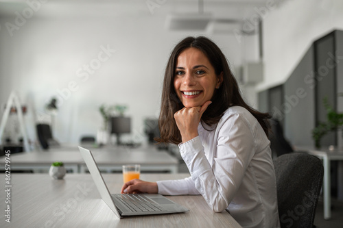 Photo of a young female employee smilling