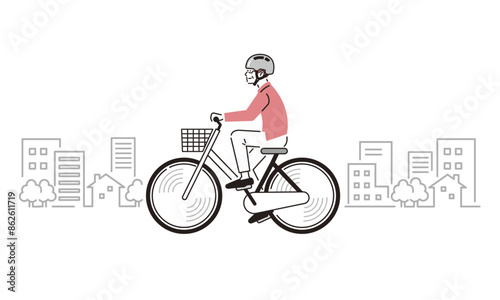 ヘルメットを装着して自転車をこぐシニア男性