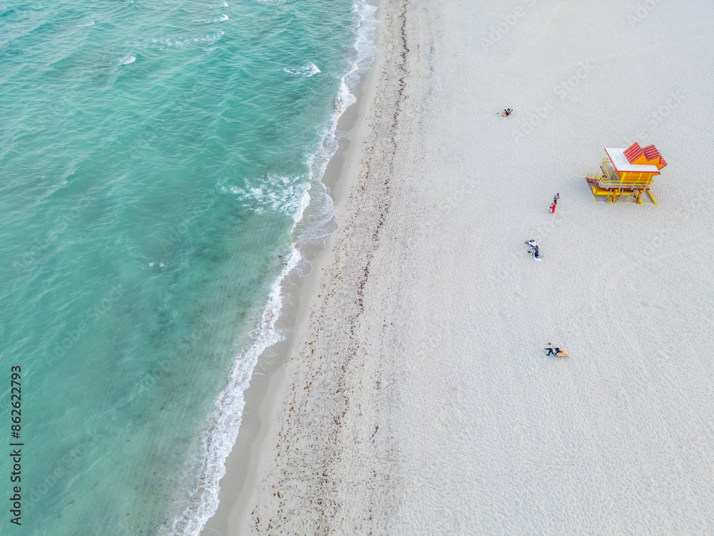 Aerial view of people enjoying Miami Beach coastline and Atlantic Ocean, Miami Beach, Florida, United States. Aerial view of people enjoying Miami Beach coastline and Atlantic Ocean, Miami Beach, Florida, United States.