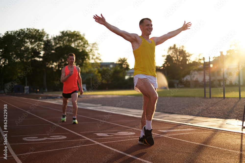 Obraz premium Portrait of a winning athlete in a race at the stadium