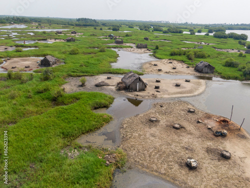 Aerial view of wetlands village with huts and water channels, Djegbadji, Republic of Benin. photo