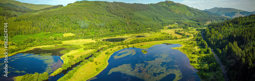 Aerial view of Loch Lubnaig surrounded by lush greenery and majestic mountains, Callander, Scotland, United Kingdom. photo