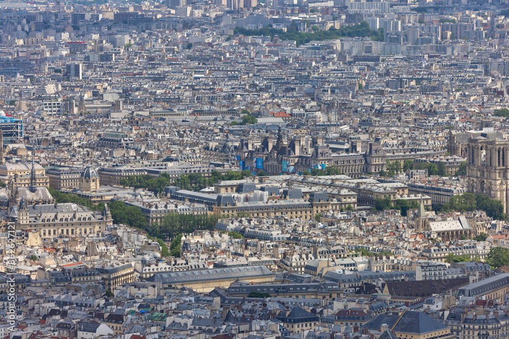 Aerial view of historic buildings and dense rooftops in Paris, Ile de France, France. Aerial view of historic buildings and dense rooftops in Paris, Ile de France, France.