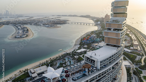 Dubai, United Arab Emirates - 06 February 2023: Aerial view of Atlantis The Royal, Hotel with stunning coastline and sunset, Dubai, United Arab Emirates. photo