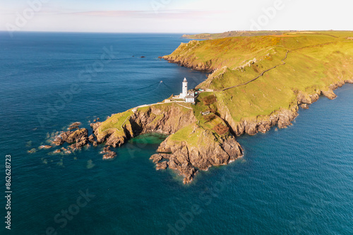 Aerial view of Start Point Lighthouse, cliffs, and ocean at headland, Kingsbridge, England. photo