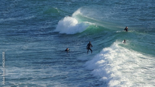 Surfing / Riding waves at Banana Beach Agadir Morocco photo