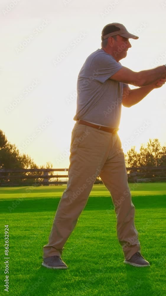 VERTICAL VIDEO. Male hand in a golf glove puts the ball on the field. Golfer placing golf ball on the tee at golf course. Close up VERTICAL VIDEO. Male hand in a golf glove puts the ball on the field. Golfer placing golf ball on the tee at golf course. Close up