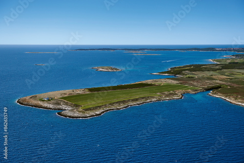 Aerial view of vineyards, islands, and coastline in Marlera Peninsula, Istria, Croatia. photo