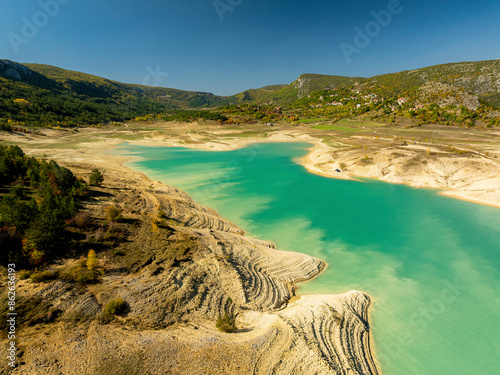 Aerial view of scenic Zeleno Jezero with turquoise water and geological terrain, Prolozac, Croatia. photo