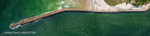 Aerial view of breakwater and beach along the ocean shoreline, Wells, Maine, United States. photo