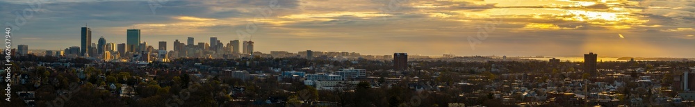 Aerial view of sunset cityscape with skyline view and city buildings, Jamaica Plain, Massachusetts, United States. Aerial view of sunset cityscape with skyline view and city buildings, Jamaica Plain, Massachusetts, United States.