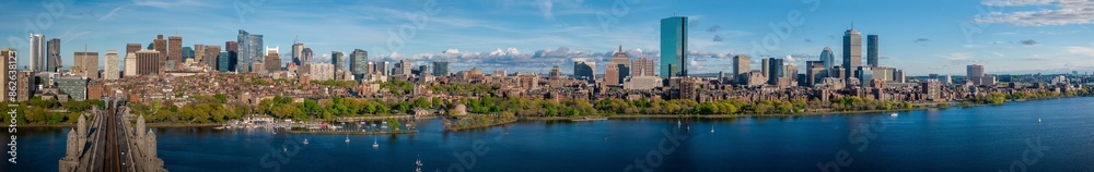Aerial view of urban skyline with river, skyscrapers, and bridge, kendall square, cambridge, massachusetts, united states. Aerial view of urban skyline with river, skyscrapers, and bridge, kendall square, cambridge, massachusetts, united states.
