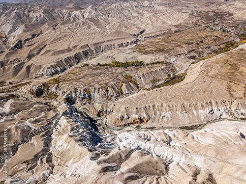 Aerial view of majestic mountains and rugged desert in Mustang, Lo Manthang, Nepal. photo