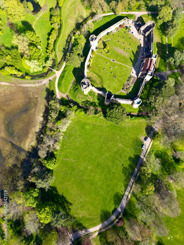 Aerial view of Caldicot Castle surrounded by greenery and trees, Caldicot, Wales, United Kingdom. photo