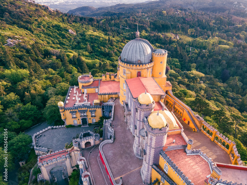 Aerial view of Pena Palace castle on mountain top in Sintra, view of the colourful interiors, SIntra, Lisbon, Portugal.