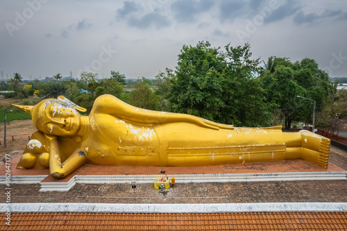 The big golden reclining Buddha at Wat Aranyikawas, Ratchaburi, Thailand photo