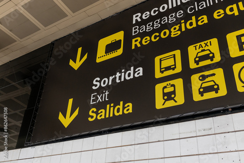 Obraz na płótnie Exit, car rental, bus, train and taxi sign at international airport. Follow the yellow sign at airport w salonie