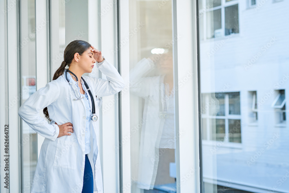 Woman, doctor and headache in grief, burnout or mistake against glass window in hospital building. Frustrated or sad physician or medical healthcare person in stress, loss or failed surgery at clinic Woman, doctor and headache in grief, burnout or mistake against glass window in hospital building. Frustrated or sad physician or medical healthcare person in stress, loss or failed surgery at clinic