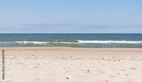 Fototapeta Naklejka Na Ścianę i Meble -  Baltic sea. Sand, sky, sea water and waves. The Baltic sea in the Kurshskaya Kosa in the Kaliningrad region. 