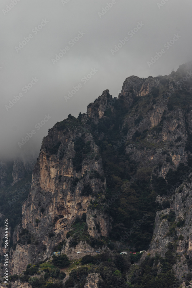 View of Majestic Lattari Mountain Range with Rocky Cliffs and Clouds, Amalfi Coast, Italy. View of Majestic Lattari Mountain Range with Rocky Cliffs and Clouds, Amalfi Coast, Italy.