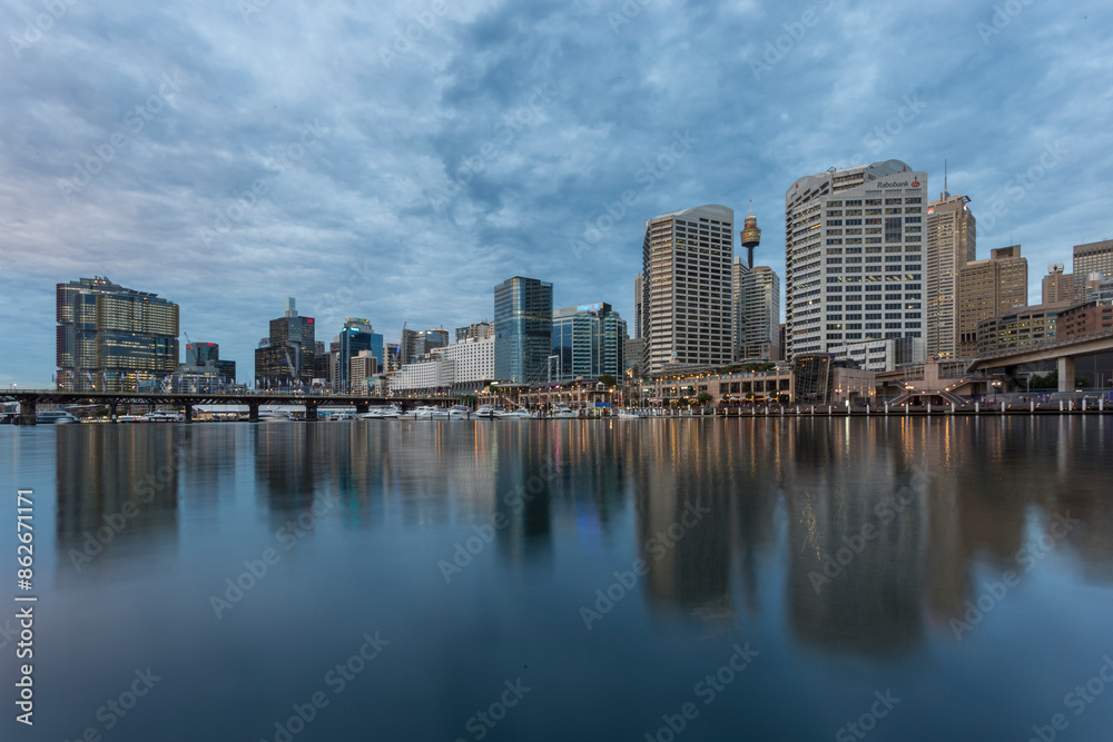 View of Darling Harbour at evening with modern buildings and cloudy sky, Sydney, New South Wales, Australia. View of Darling Harbour at evening with modern buildings and cloudy sky, Sydney, New South Wales, Australia.